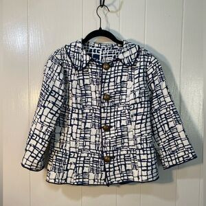 Trimdin reversible jacket with a navy and white abstract/cobblestone pattern